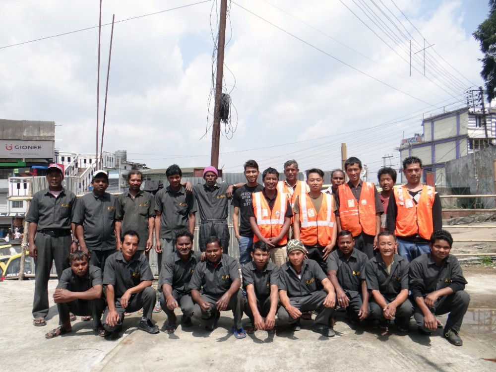 Sanitation workers under Kohima Municipal Council pose for a photograph.